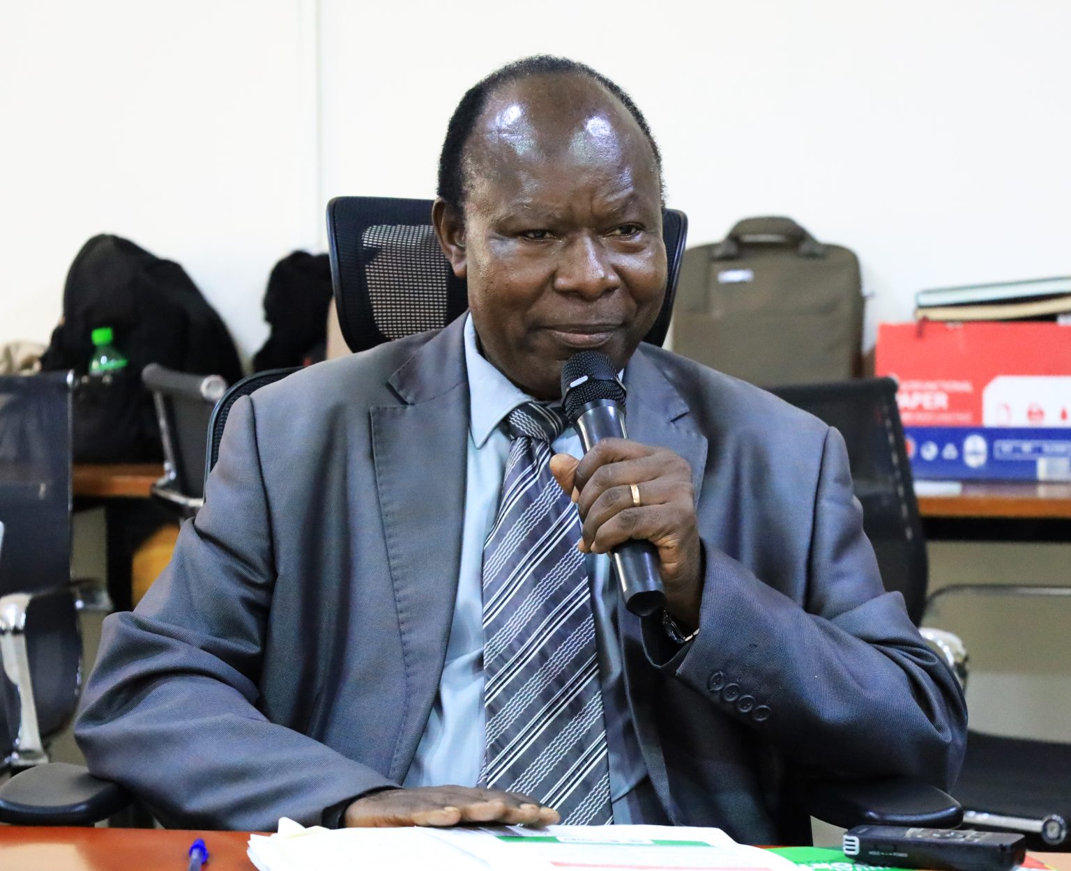 Prof. Muyodi, the Director of Makerere University Writing Center giving his remarks during the meeting